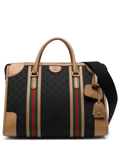 gucci bauletto|Large GG duffle bag in beige and ebony GG canvas .